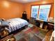 Cozy bedroom with large window and hardwood floors at 308 N Hawthorne St, Mount Holly, NC 28120