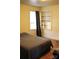 Bedroom with hardwood floors, built in shelves, and natural light at 308 N Hawthorne St, Mount Holly, NC 28120