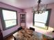 A dining area featuring a table, chairs, and a window at 308 N Hawthorne St, Mount Holly, NC 28120