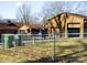 Exterior view of garage and house with fenced yard and room for outdoor activities and parking at 308 N Hawthorne St, Mount Holly, NC 28120