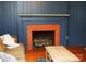 Living room showcasing a fireplace, providing warmth and a focal point in the space at 308 N Hawthorne St, Mount Holly, NC 28120