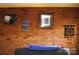 Brick wall featuring decorative art, lending character and charm to the interior space at 308 N Hawthorne St, Mount Holly, NC 28120