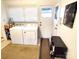 Bright laundry room with washer, dryer, window and neutral decor at 308 N Hawthorne St, Mount Holly, NC 28120