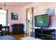 Comfortable Living Room, with a painting of Einstein, offers versatile living and dining space at 308 N Hawthorne St, Mount Holly, NC 28120