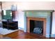 Living room featuring brick fireplace and built-in mantle at 308 N Hawthorne St, Mount Holly, NC 28120
