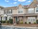 Front view of charming townhouses with brick accents and landscaping at 3100 Windsor Trace Dr, Fort Mill, SC 29707