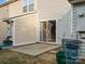 View of backyard with patio, sliding glass door, and trash receptacles at 3102 Windsor Trace Dr, Fort Mill, SC 29707