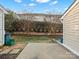 Small backyard with a patio, storage shed, and privacy landscaping at 3102 Windsor Trace Dr, Fort Mill, SC 29707