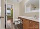 Bathroom with wood floor, vanity, toilet and shower at 3102 Windsor Trace Dr, Fort Mill, SC 29707