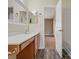 Bathroom with wood floor, vanity, and access to bedroom at 3102 Windsor Trace Dr, Fort Mill, SC 29707