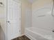Simple bathroom with tub, shower and door at 3102 Windsor Trace Dr, Fort Mill, SC 29707
