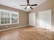 Bedroom with wood floors, double closets, and ceiling fan at 3102 Windsor Trace Dr, Fort Mill, SC 29707