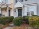Gray townhome exterior with dark door and shrubs at 3102 Windsor Trace Dr, Fort Mill, SC 29707
