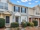 Front view of two-story townhouses with landscaping and steps leading to the entrance at 3102 Windsor Trace Dr, Fort Mill, SC 29707
