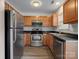 Modern kitchen with stainless steel appliances and wood cabinets at 3102 Windsor Trace Dr, Fort Mill, SC 29707