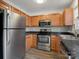 Modern kitchen with stainless steel appliances and wood cabinets at 3102 Windsor Trace Dr, Fort Mill, SC 29707
