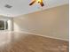 Spacious living room with hardwood floors and ceiling fan at 3102 Windsor Trace Dr, Fort Mill, SC 29707