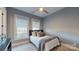 Cozy bedroom with a double bed and large windows at 3238 Park Rd, Charlotte, NC 28209