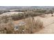 Aerial view showing a house on a lot with a road and trees at 3535 Tines Dr, Midland, NC 28107