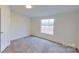 Spacious bedroom with large window and carpeted floor at 3535 Tines Dr, Midland, NC 28107