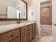 Bright bathroom with a large mirror and granite countertop vanity, with an adjoining shower at 3850 Hounslow Ln, Harrisburg, NC 28075