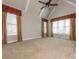 Bedroom with vaulted ceilings, carpet, and large windows offering plenty of natural light at 3850 Hounslow Ln, Harrisburg, NC 28075