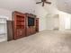 Bedroom featuring carpet, vaulted ceiling, and a decorative entertainment center with a television at 3850 Hounslow Ln, Harrisburg, NC 28075