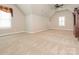 Large bedroom with high ceilings, carpet, and a window with shutters offering natural light at 3850 Hounslow Ln, Harrisburg, NC 28075