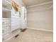 Walk-in closet featuring custom built-in shelving and drawers, providing ample storage space at 3850 Hounslow Ln, Harrisburg, NC 28075