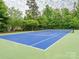A well-maintained blue and green community tennis court offers residents a place to play at 3850 Hounslow Ln, Harrisburg, NC 28075