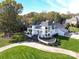 Modern home with landscaped yard, aerial view at 4129 Carnoustie Ln, Charlotte, NC 28210