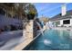 Modern pool with stone pillars and a water feature at 4129 Carnoustie Ln, Charlotte, NC 28210