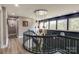 Modern staircase with sleek metal railing and chandelier at 4129 Carnoustie Ln, Charlotte, NC 28210