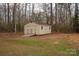 Tan colored storage shed with double doors at 421 Pineland Ct, Catawba, SC 29704