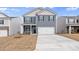 Two-story house with gray siding, white garage door, and landscaping at 4622 Harris Elliot Rd, Lincolnton, NC 28092