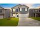 Two-story house with a two-car garage and landscaped lawn at 4622 Harris Elliot Rd, Lincolnton, NC 28092