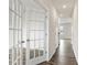 Bright hallway with hardwood floors and French doors at 4622 Harris Elliot Rd, Lincolnton, NC 28092
