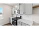 Modern kitchen with gray cabinets, white countertops, and stainless steel appliances at 4622 Harris Elliot Rd, Lincolnton, NC 28092