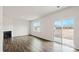 Bright living room with fireplace and sliding glass door leading to backyard at 4622 Harris Elliot Rd, Lincolnton, NC 28092