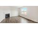 Living room with corner fireplace and hardwood floors at 4622 Harris Elliot Rd, Lincolnton, NC 28092