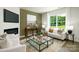 Living room features a fireplace, large TV, and comfortable seating at 4622 Harris Elliot Rd, Lincolnton, NC 28092