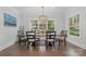 Bright dining area with hardwood floors, a large table, and plenty of natural light at 48 Quiet Cv, Concord, NC 28027