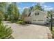 House exterior with attached two-car garage and basketball court at 48 Quiet Cv, Concord, NC 28027