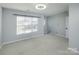 Bedroom with large window and ceiling fan at 5726 Cactus Valley Rd # 238, Charlotte, NC 28277