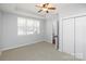 Bedroom with ceiling fan, large window, and closet at 5726 Cactus Valley Rd # 238, Charlotte, NC 28277