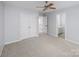 Bright bedroom with double doors and carpet flooring at 5726 Cactus Valley Rd # 238, Charlotte, NC 28277
