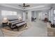 Main bedroom with sitting area and large bed at 5726 Cactus Valley Rd # 238, Charlotte, NC 28277