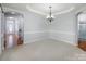 Bright dining room with hardwood floors and chandelier at 5726 Cactus Valley Rd # 238, Charlotte, NC 28277