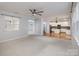 Open living room with kitchen view and hardwood floors at 5726 Cactus Valley Rd # 238, Charlotte, NC 28277