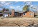 Brick ranch house with a spacious yard and mature trees at 6613 Weldon Nw Cir, Concord, NC 28027